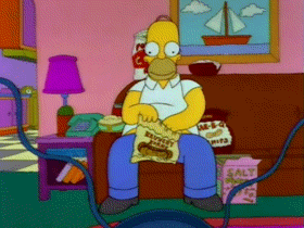 Homer-Watching-TV-Eating-Junk-Food-On-The-Simpsons