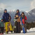 family-skiwear-standing-together-snowy-alps